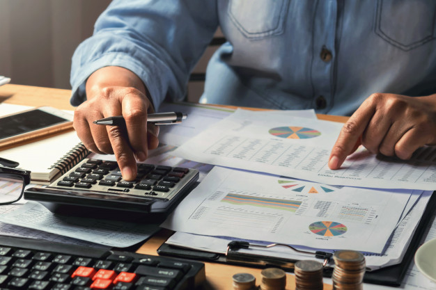 accounting-concept-businesswoman-working-using-calculator-with-money-stack-office-34152-2245-2